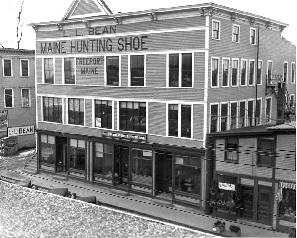Historic L.L. Bean store in Freeport, Maine, featuring the sign "Maine Hunting Shoe" on the building's facade.