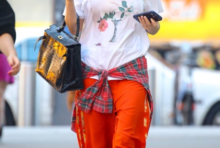 exclusive new york city, ny jennifer lawrence matches casual red pants, a t shirt and loafers with a stylish black leather bag as she takes a stroll in new york, ny pictured jennifer lawrence backgrid usa 18 september 2026 usa 1 310 798 9111 usasalesbackgridcom uk 44 208 344 2007 uksalesbackgridcom uk clients pictures containing children please pixelate face prior to publication