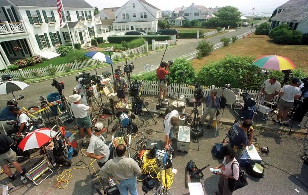 Members of the media stand by the entran