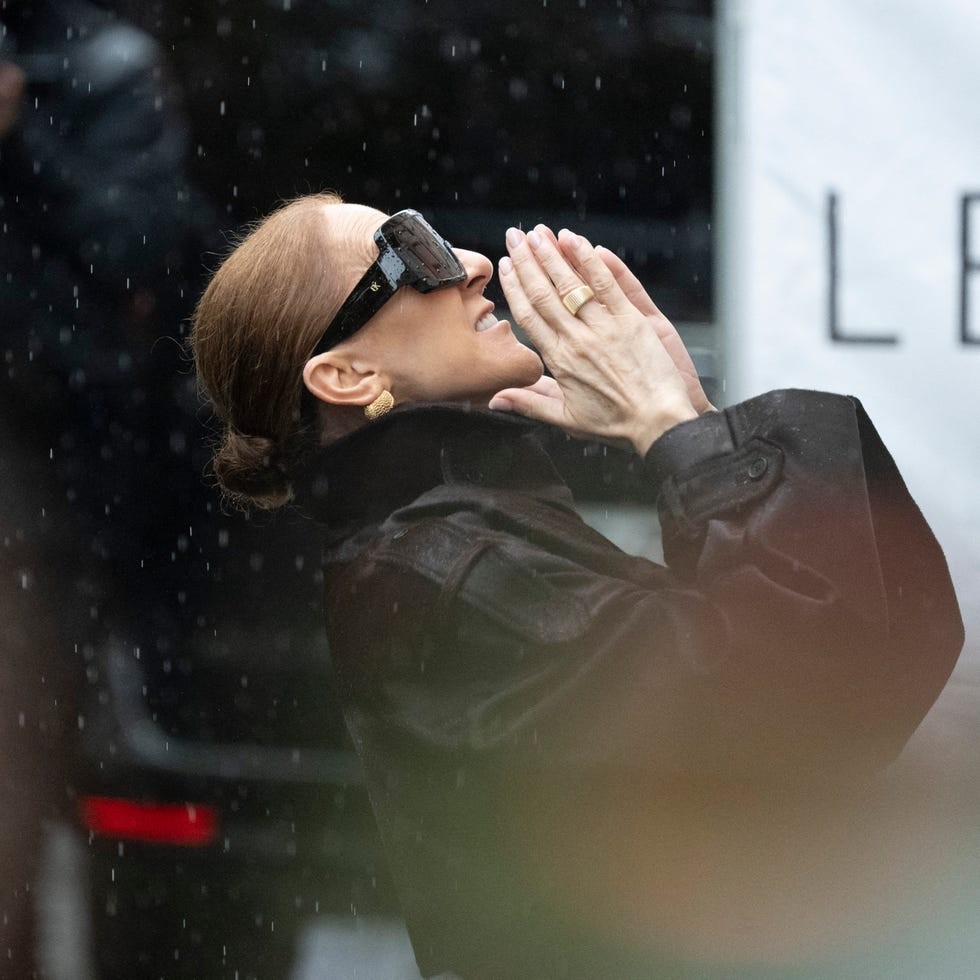 celine dion steps out of her hotel and waves to her fans at the royal monceau hotel, under the rain, in paris on september 30, 2026. (photo by magali cohen / hans lucas / afp via getty images)