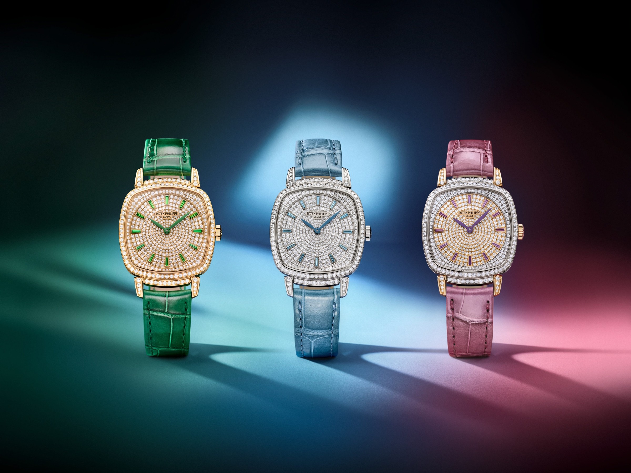 Three luxury watches with colorful straps and diamond embellishments against a gradient background.