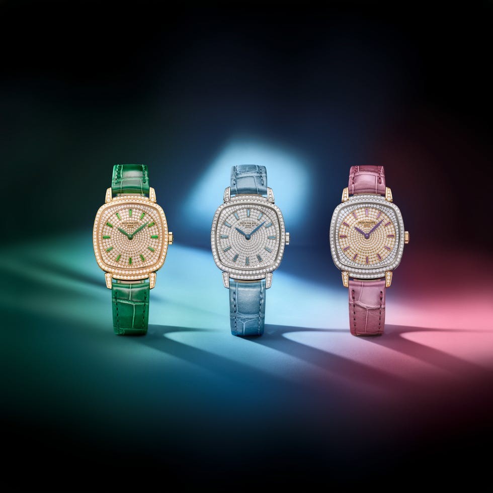 Three luxurious watches with colorful straps and sparkling embellishments against a gradient background.