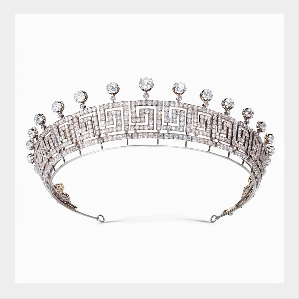 A decorative tiara with a geometric design and sparkling gemstones.