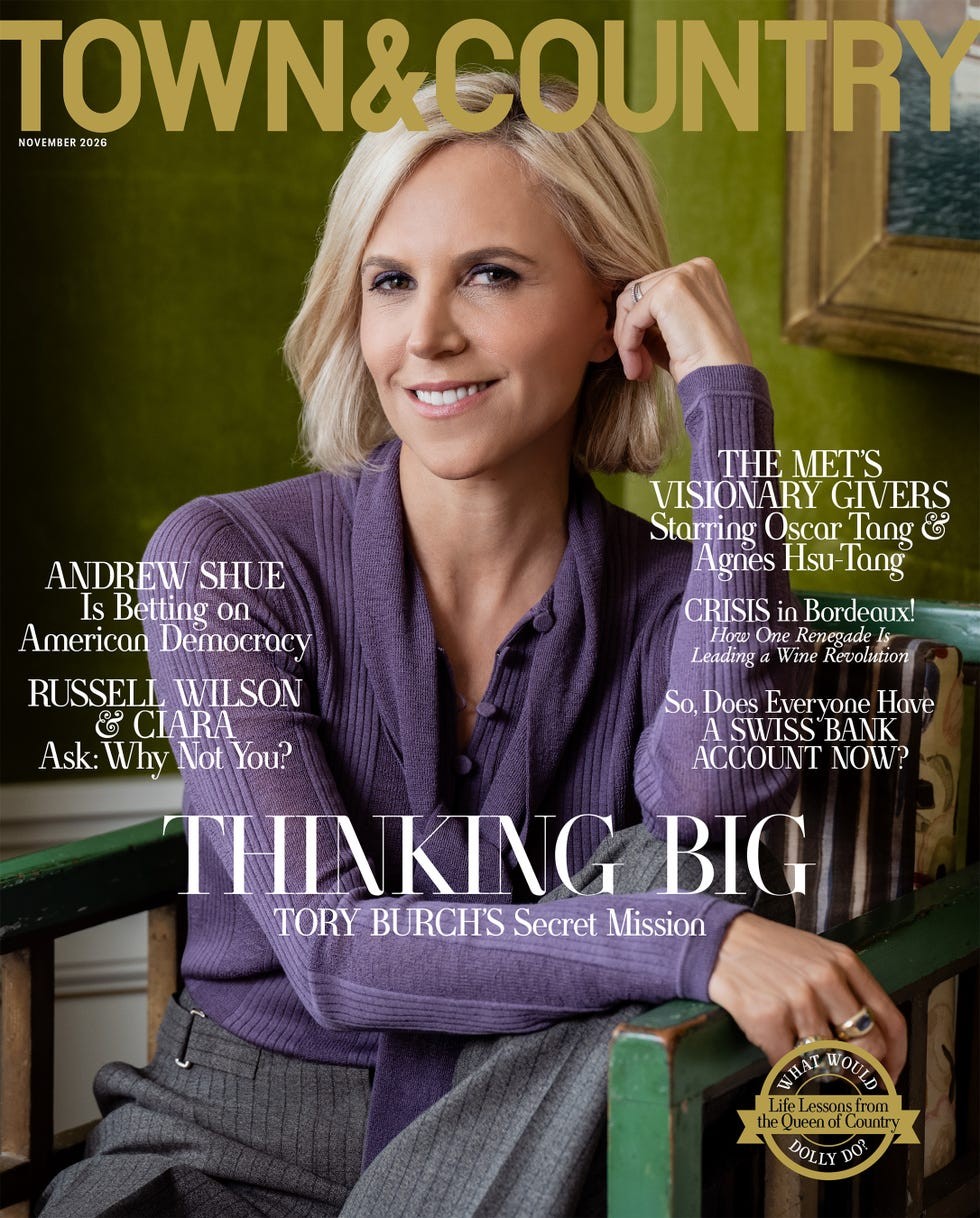 A woman with short blonde hair smiling, wearing a purple sweater, featured on the cover of Town & Country magazine.