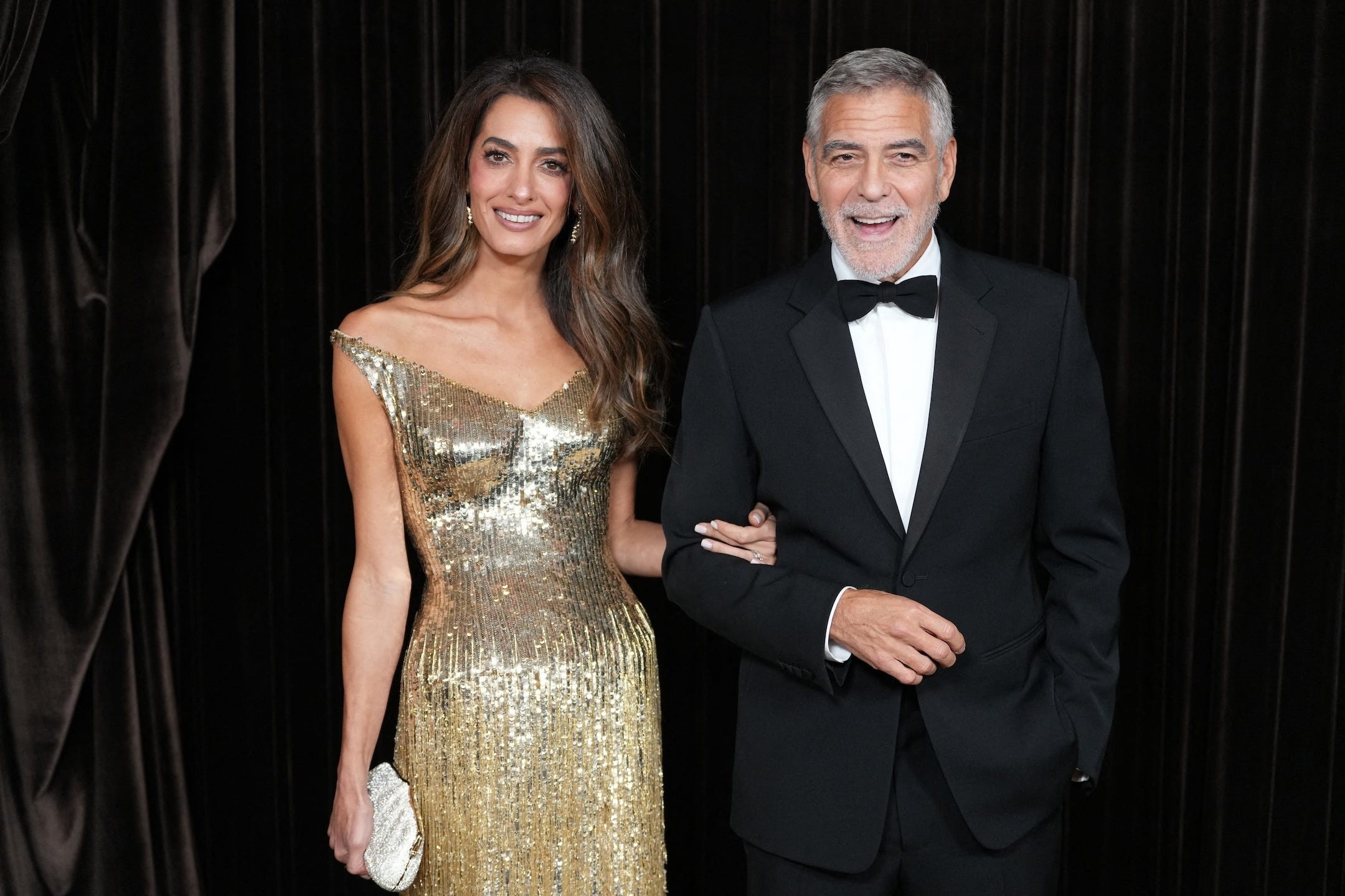 us actor george clooney and lebanese british barrister amal clooney pose upon arrival to attend the albies hosted by the clooney foundation of justice at the natural history museum in london on october 9, 2026 photo by carlos jasso  afp