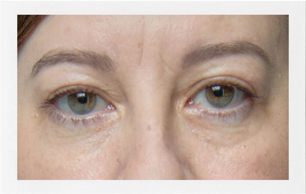 Close-up of a person's eyes displaying various shades of green and brown.